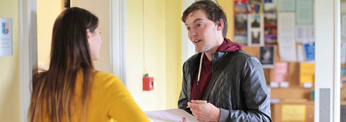 International Office - Student  & staff chatting - Maynooth University