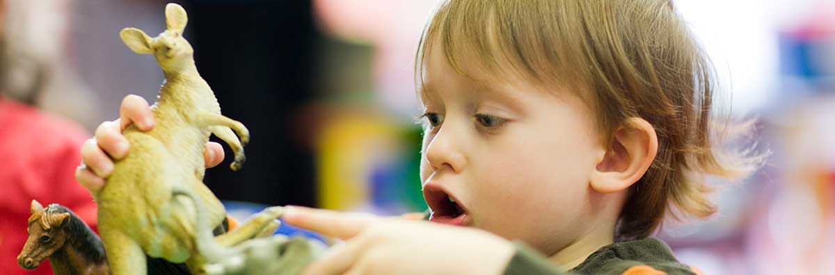 Student Services - boy playing with toy creche carousel 1200 x 200 - Maynooth University