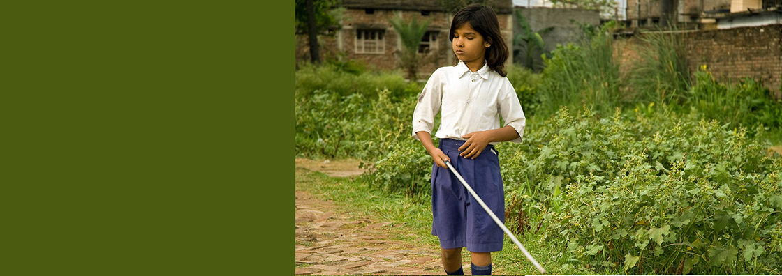 Blind girl using cane 