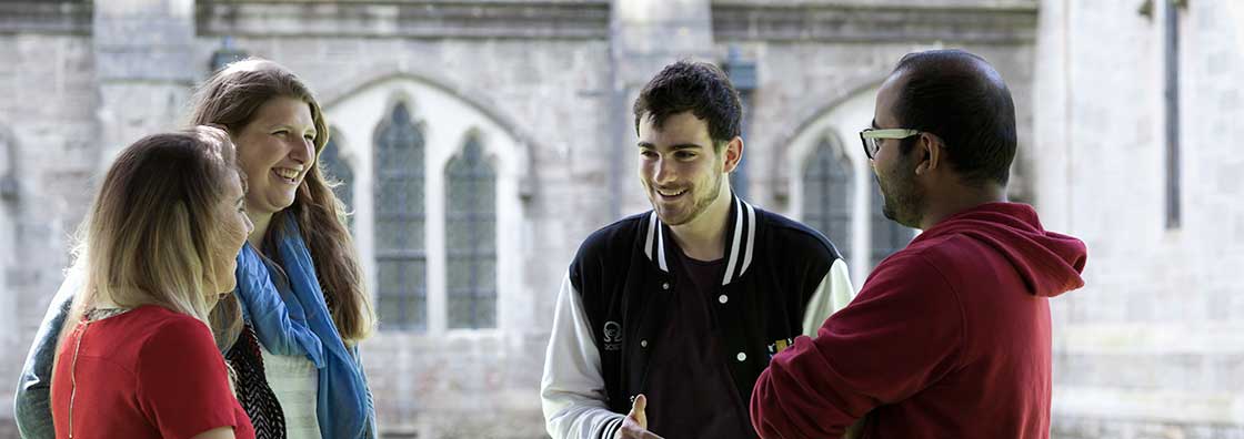 Student Services - four students chatting outdoor - Maynooth University
