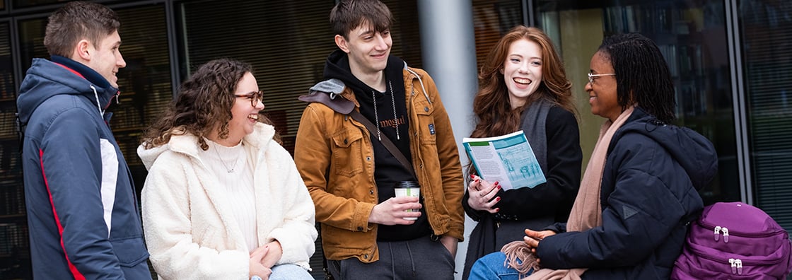 postgraduate students chatting outside