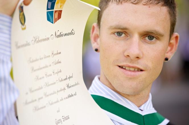 Graduation 2012 - male with scroll - Maynooth University