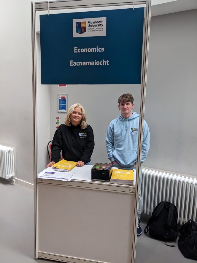 two master students at the economics stand in the tsi building, maynooth university, undergraduate open day