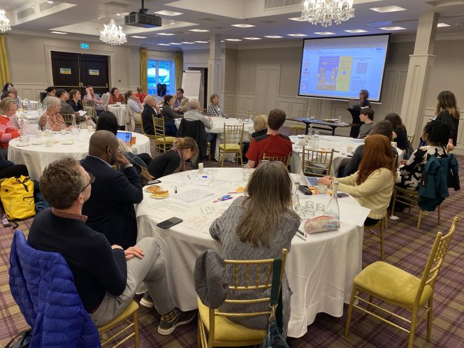Attendees listening to keynote address