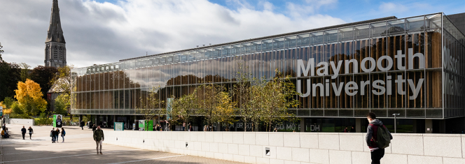 Maynooth University library with students walking past