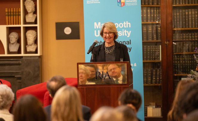 Woman at podium speaking