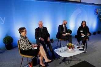 People speaking at a panel session for the EU 50 conference