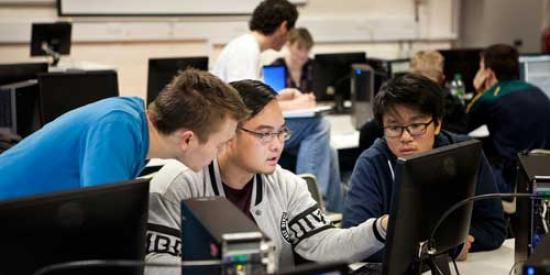 Computer science - Students at laptop 500 x 333 - Maynooth University