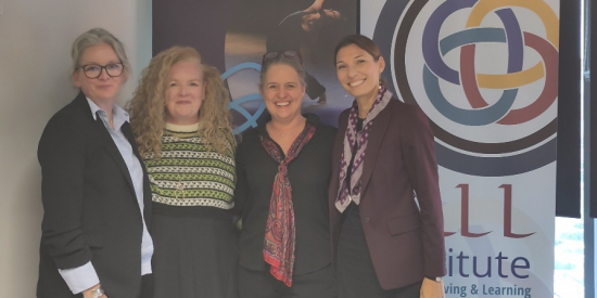 Picture of Prof. Deirdre Desmond, Dr Shivaun Quinlivan, Prof. Cora True Frost & Prof. Delia Ferri. They are standing in front of the banners of the ALL Institute and the ERC DANCING project.