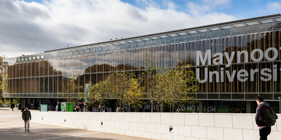 Maynooth University library with students walking past