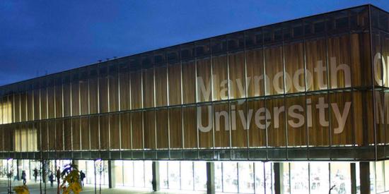 Communications - Library sign at night - Maynooth University