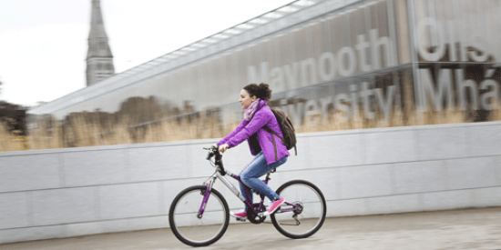 IO_International student cycling outside library