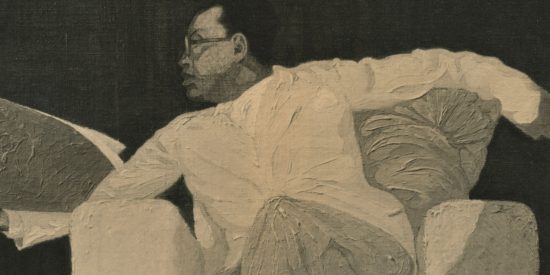 Black and white image of a man with glasses, in white clothes, sitting on an armchair