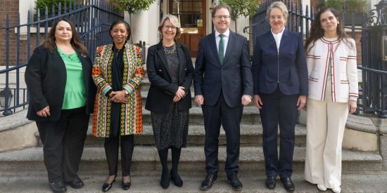 5 women and 1 man posing for picture outside Royal Irish Academy for International Women's Day