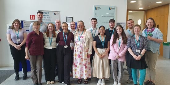 Shared Learning Day group photo, with students gathered in a group in the foyer of the School of Education