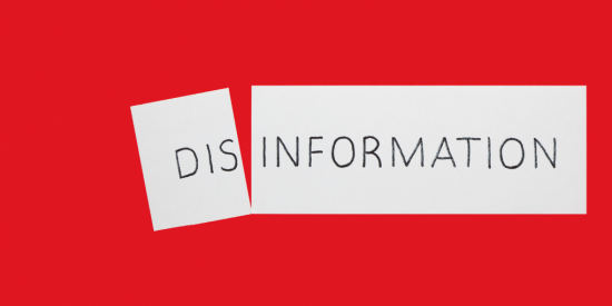red background with white text spelling the word disinformation 