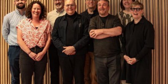 A group of 8 delegates stand together, with smiling faces, they include From left: Dr Ciarán Ó Gallchoir, Dr Marianne O’Shea (Dept Applied Social Studies, MU), Dr Joe Oyler, Prof Carl Anders Säfström, Prof Gert Biesta, Dr Glenn Loughran (TUD), Dr Angela Rickard, Prof Sharon Todd. 