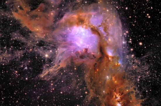 Black cosmos background with pink and orange nursery of star formation