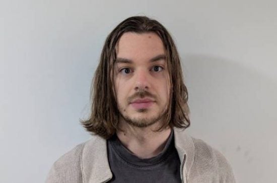 Szymon Urbas headshot